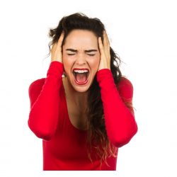 woman with dark hair wearing a red shirt has hands on either side of her head, eyes closed and mouth open like she is shouting in frustration